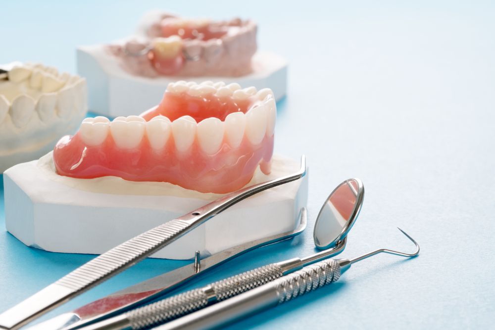 Deciding Between Dental Implants And Dentures.docx
